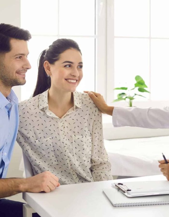 Female,Doctor,Consulting,Young,Couple,Patients,In,Fertility,Clinic,About